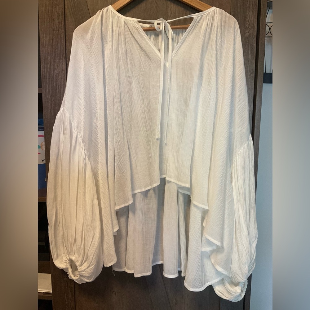 Elegant White Women's Oversized Peasant Crinkle hi-low Top with ballon sleeves .